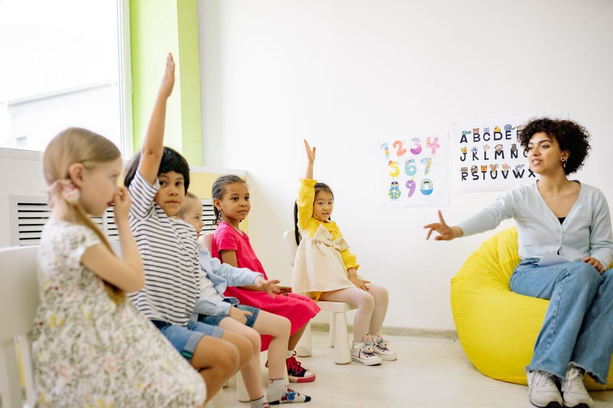 Children listening to a story during school-based ABA therapy in Aurora, CO
